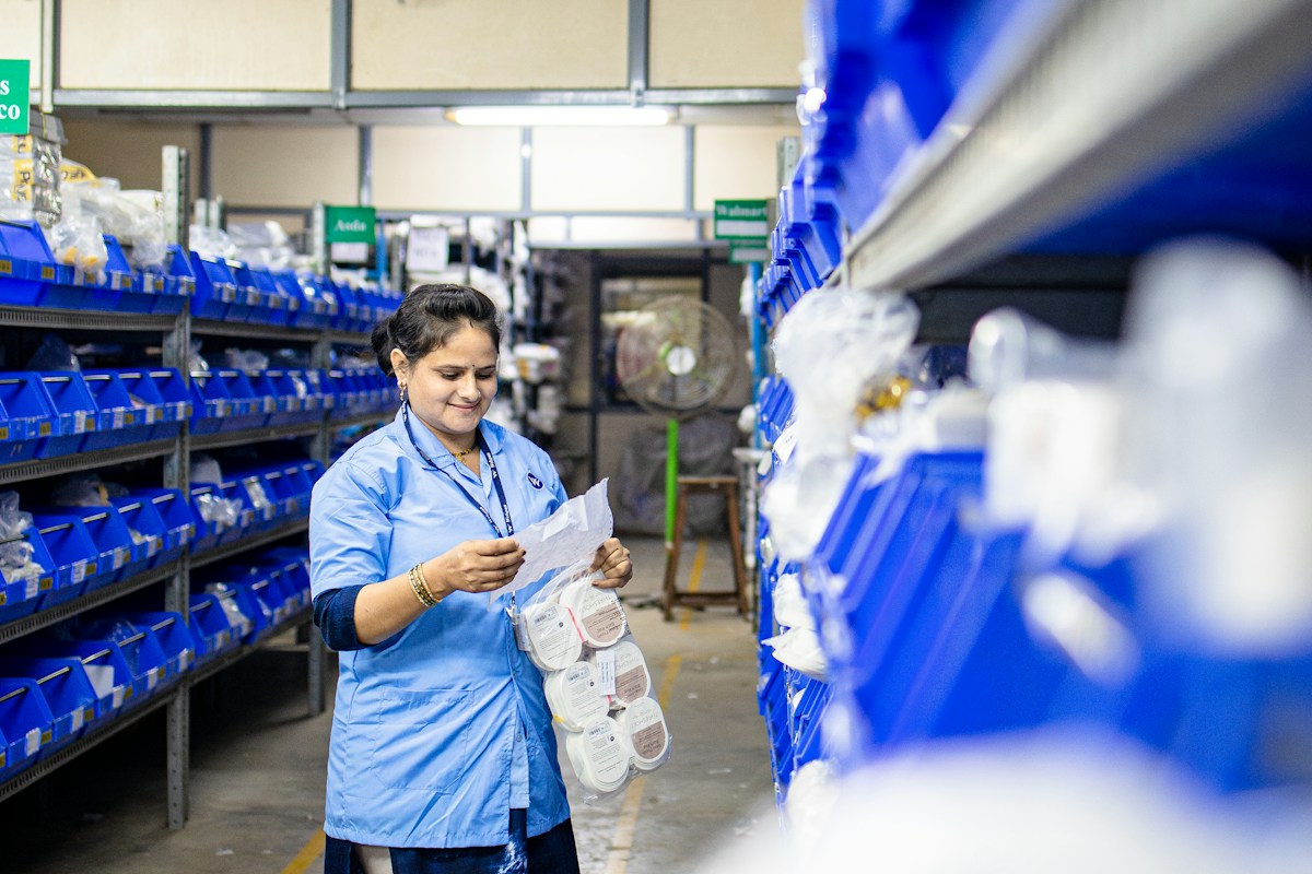 Warehouse employee reviewing product quality details