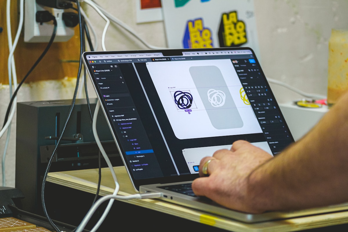 Designer preparing advertising creatives on a laptop